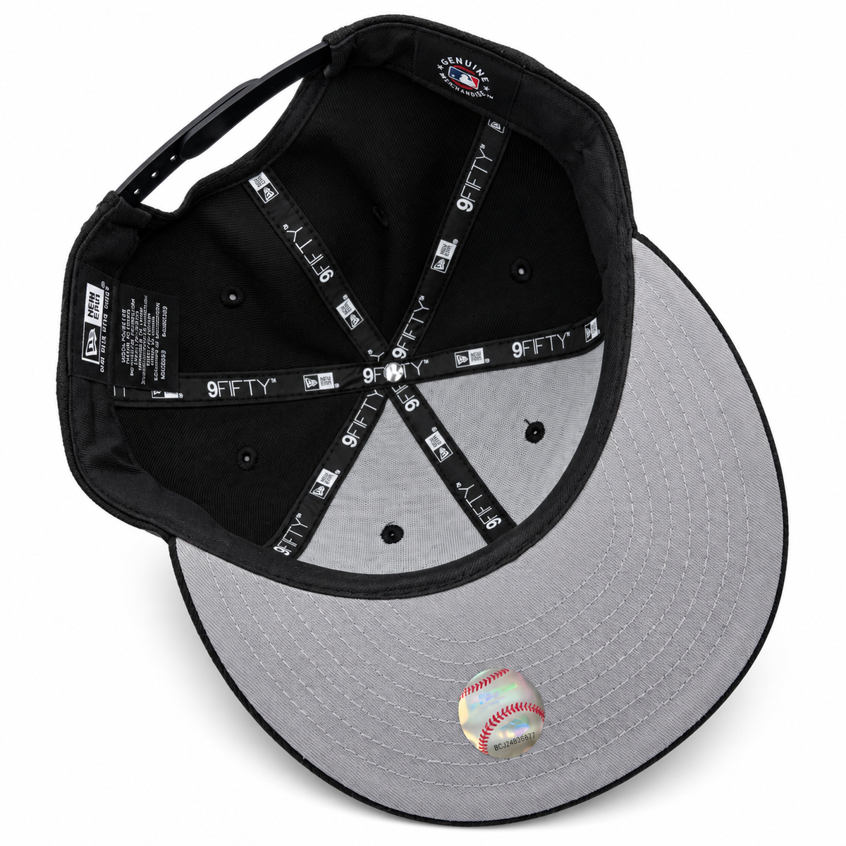 New York Yankees black New Era 9FIFTY snapback hat with aqua and yellow embroidery – underside view with black crown lining and grey undervisor