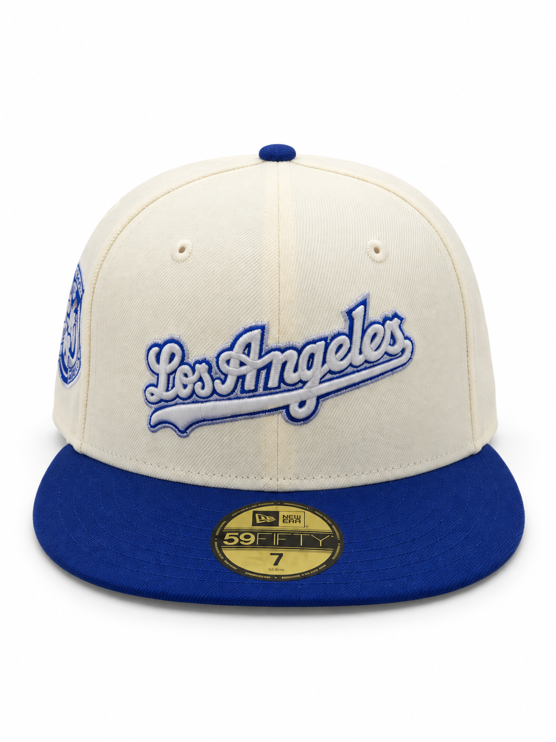 Los Angeles Dodgers New Era 59FIFTY fitted hat in cream and royal blue – front view with blue Los Angeles script and embroidered side patch