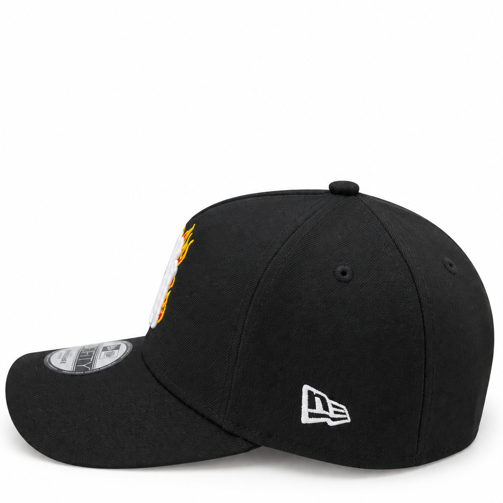 New Era New York Yankees black flame 9FORTY A-Frame cap – side view with gold and orange flame embroidery and white New Era flag