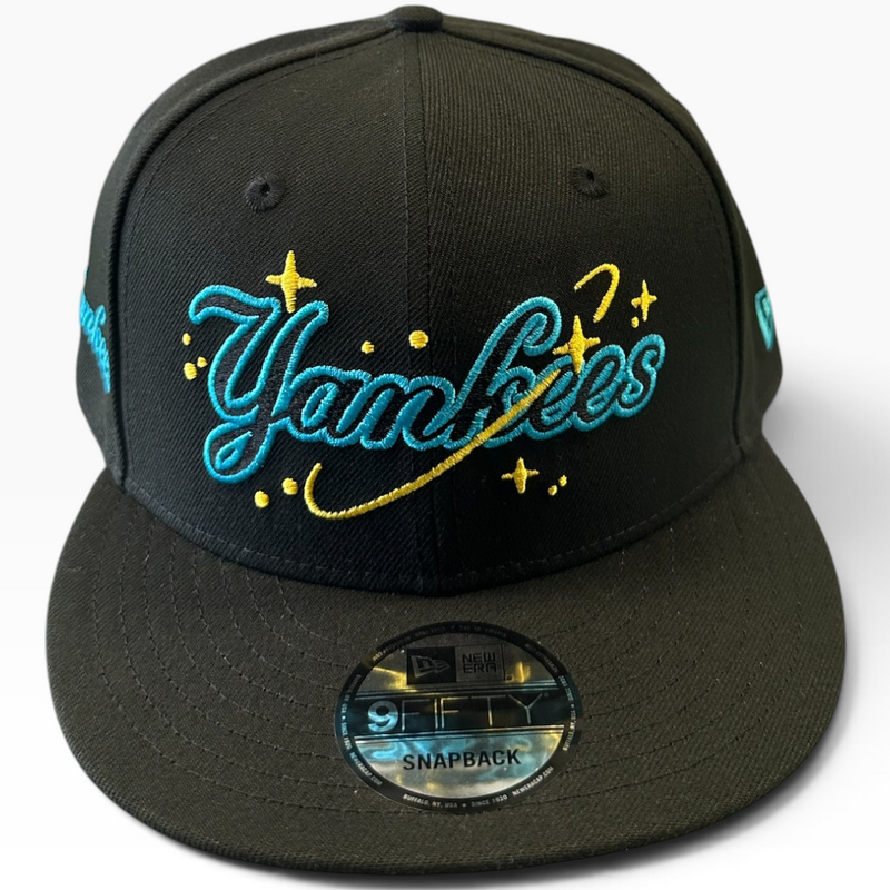 New York Yankees black New Era 9FIFTY snapback hat with aqua and yellow script - front view