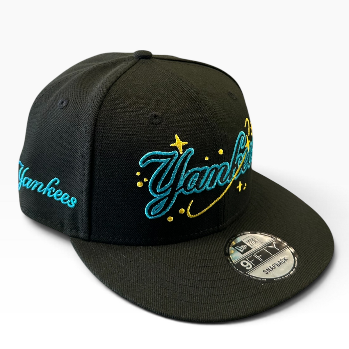 Yankees black snapback with aqua and yellow script embroidery - side view