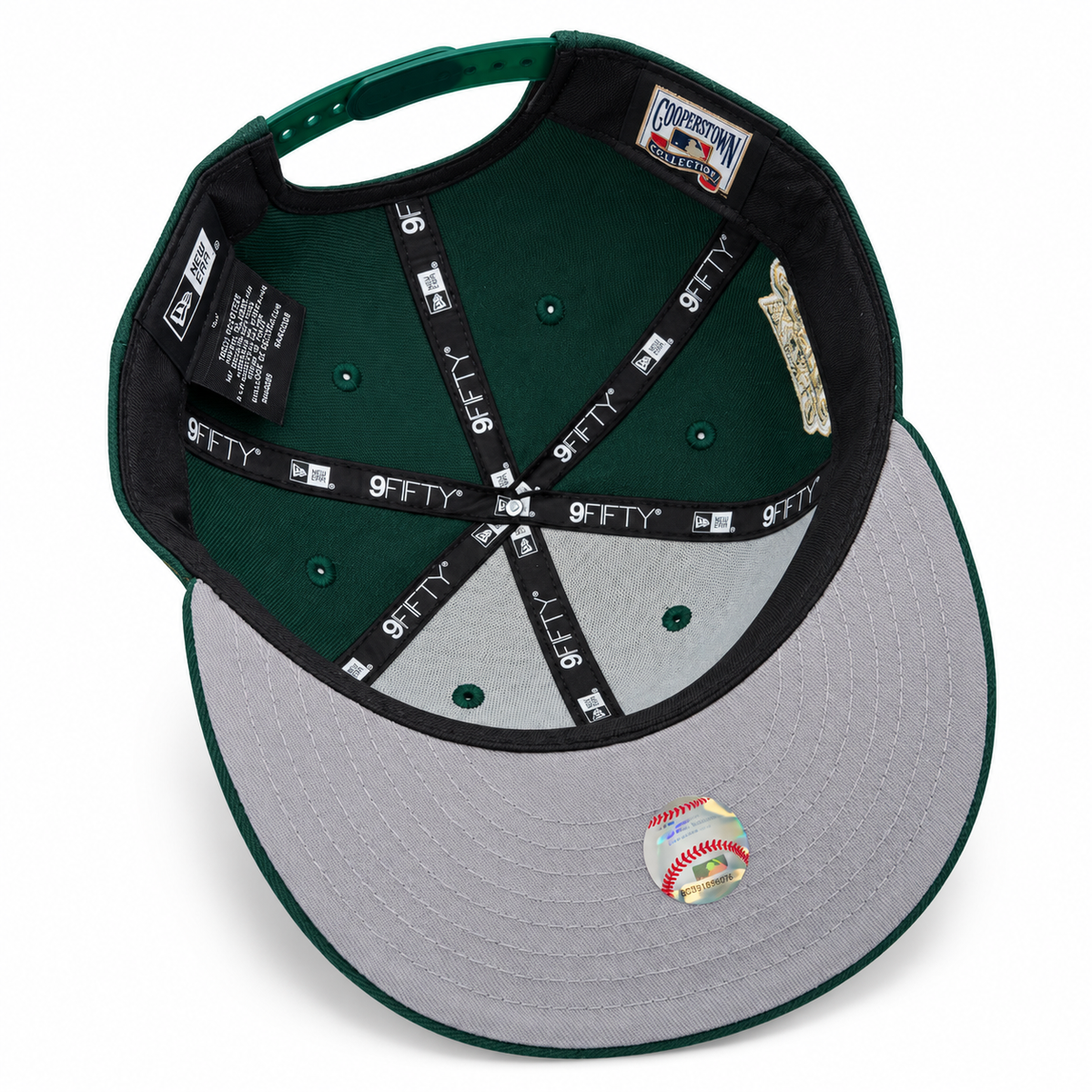 Green and gold snapback hat – underside view with green crown lining, grey undervisor and Cooperstown patch