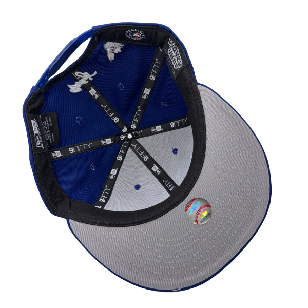 New Era Los Angeles Dodgers x Looney Tunes Bugs Bunny navy snapback hat – underside view with blue crown lining and grey undervisor