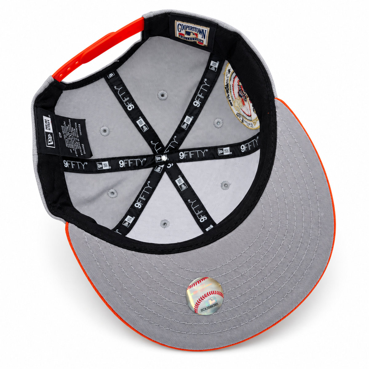 Baltimore Orioles grey and orange New Era 9FIFTY 30th Anniversary snapback hat – underside view with orange trim, grey undervisor and Cooperstown patch
