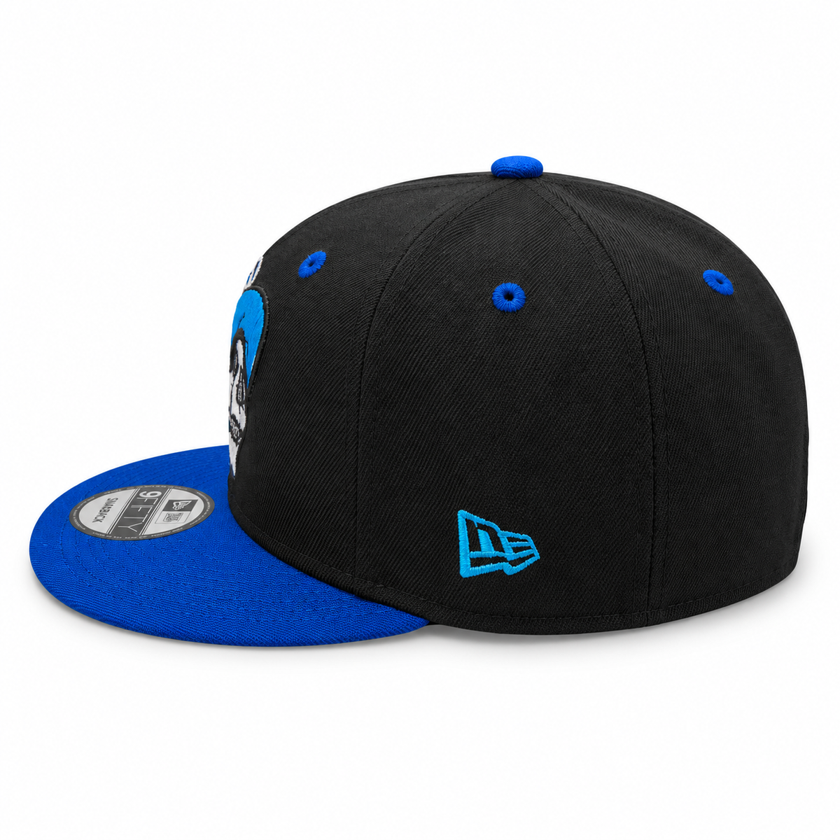 New Era black and royal blue skull graphic 9FIFTY snapback hat – side view with royal blue brim and embroidered skull graphic