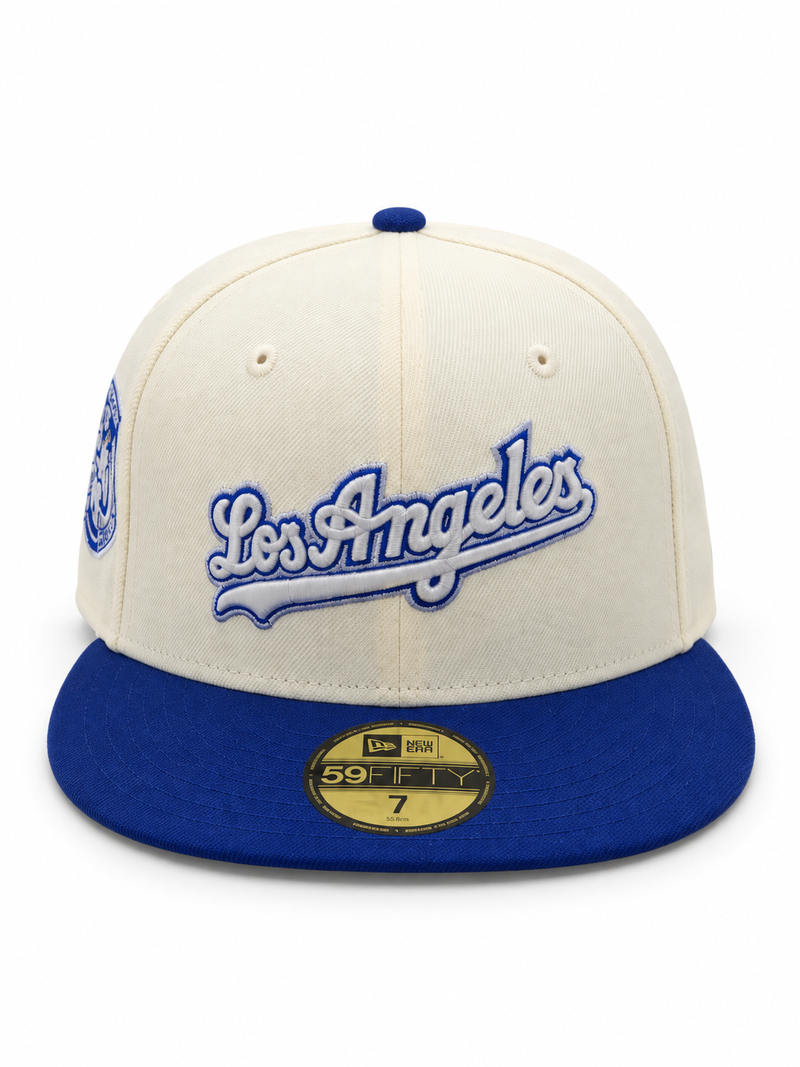 Los Angeles Dodgers New Era 59FIFTY fitted hat in cream and royal blue – front view with blue Los Angeles script and embroidered side patch