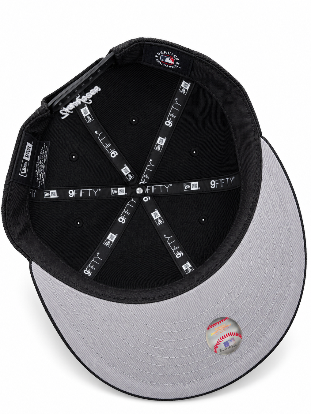 New Era cap – underside view with grey undervisor and black crown lining