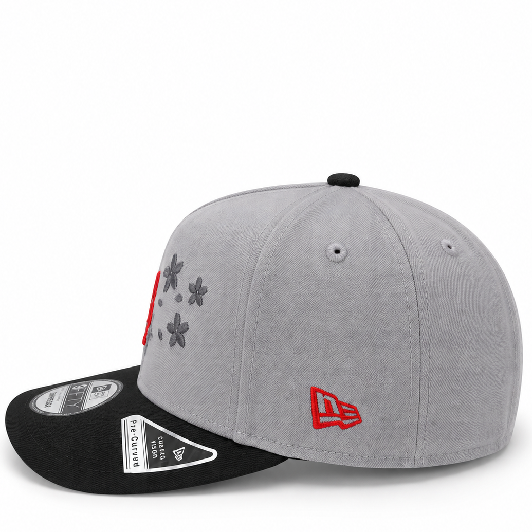 New Era Los Angeles Dodgers Floral grey and black 9FIFTY snapback hat – side view with red LA logo, floral embroidery and red New Era flag