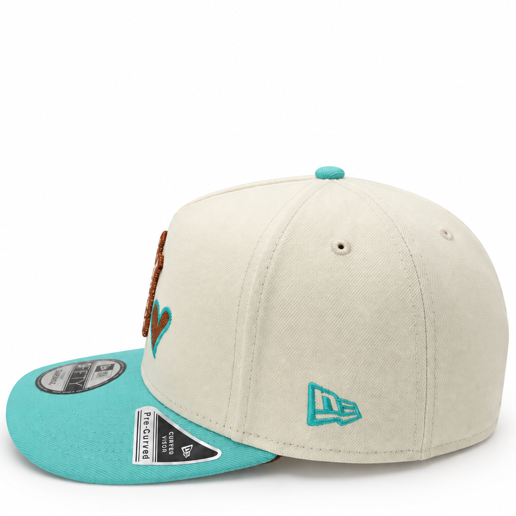 New Era NY Heart cream and turquoise 9FIFTY A-Frame snapback hat – side view with turquoise brim and embroidered heart logo