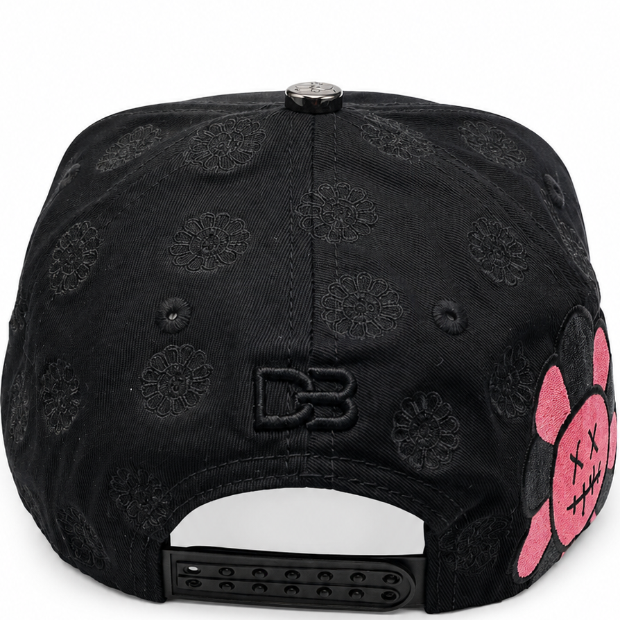 Black and pink rhinestone floral snapback with oversized flower graphic - side view