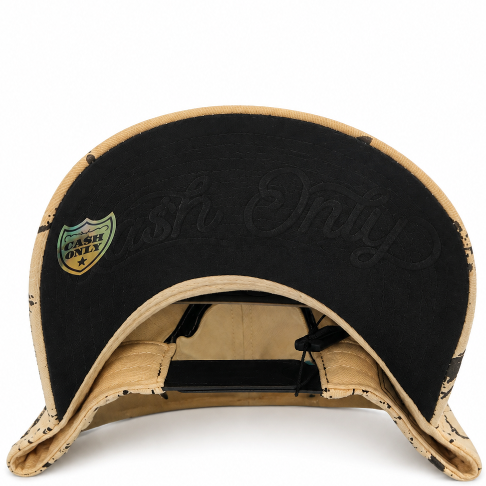 Cash Only LA paint splatter tan snapback hat with black LA lettering - front view