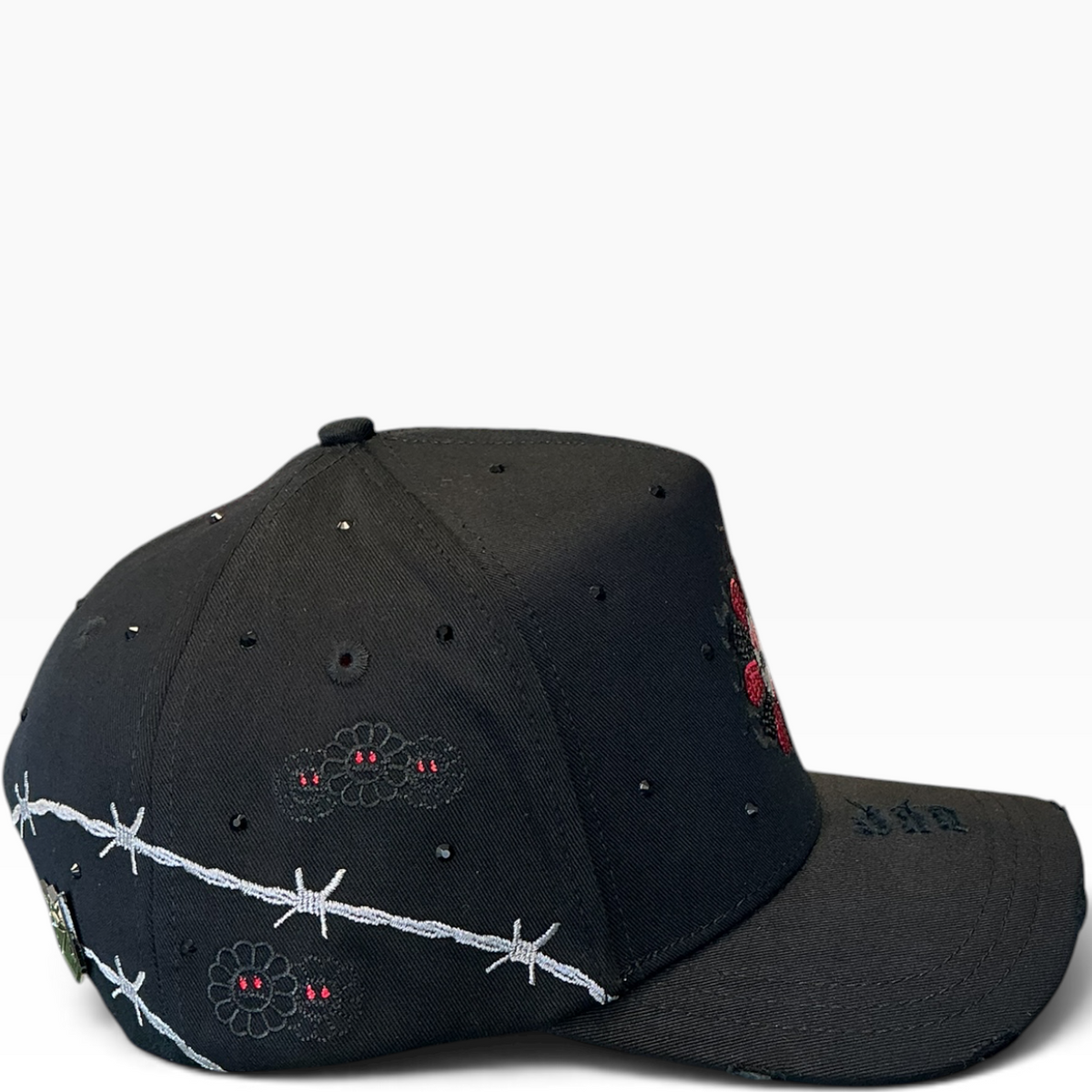 Red flower barbed wire snapback - side view