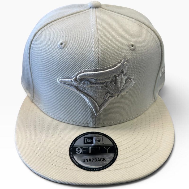 Toronto Blue Jays cream and light gray New Era 9FIFTY snapback hat - front view