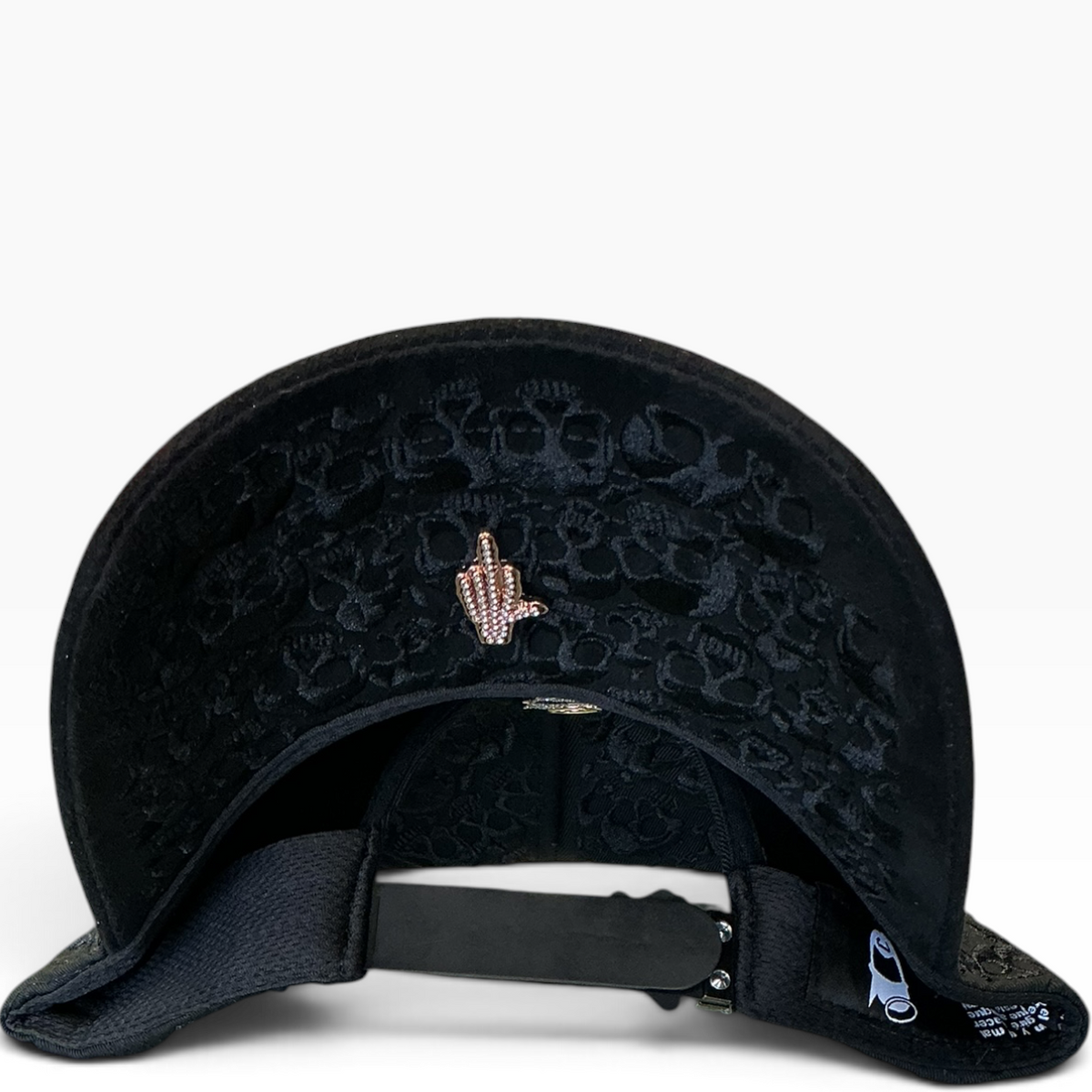 Black skull rhinestone hand gesture snapback hat - front view